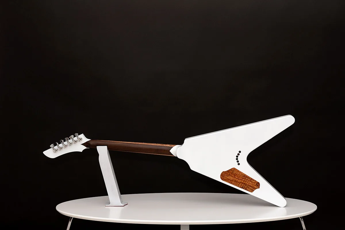This is a custom guitar, built by a well-known luthier, Augustin Cristian Apostol (@ Avatar2100). Her name is The Evil